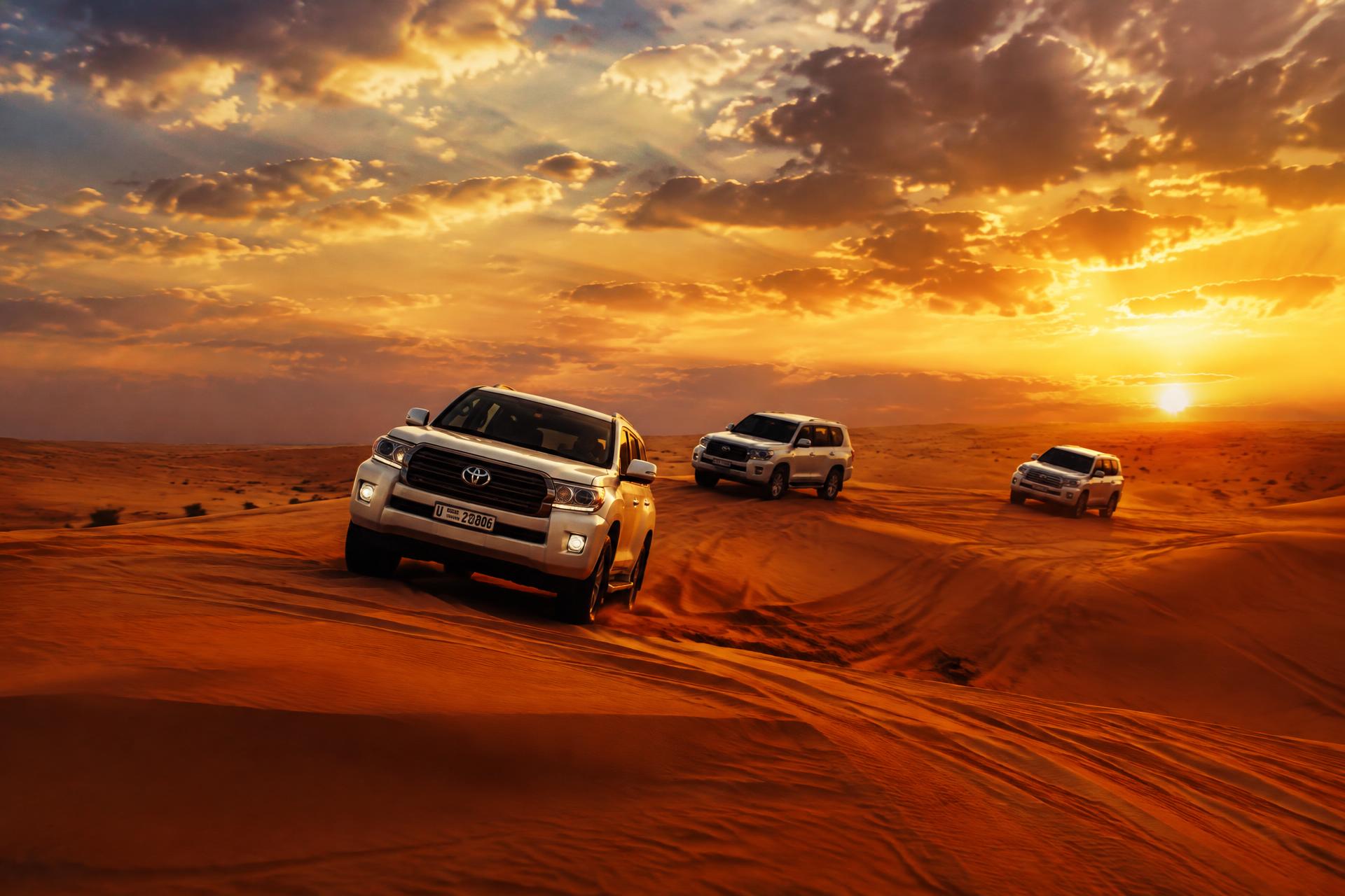 Premium desert safari across the red dunes of Dubai at sunset